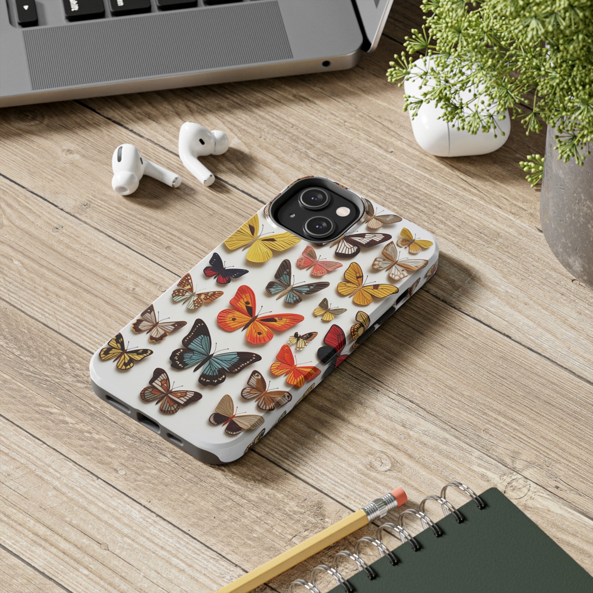 Protective iPhone 11 and 14 case with intricate butterfly patterns